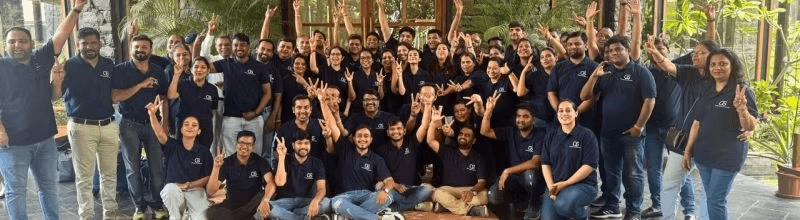 A large team wearing COTTSON corporate polos